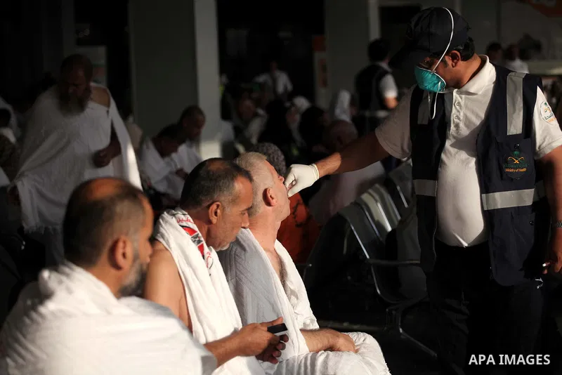 Medical workers inject vaccination for pilgrims at the King Abdulaziz international airport who go for their pilgrimage to Mecca, on Sept. 23, 2014. Hundreds of Palestinian pilgrims are leaving Gaza strip through the Raf...
