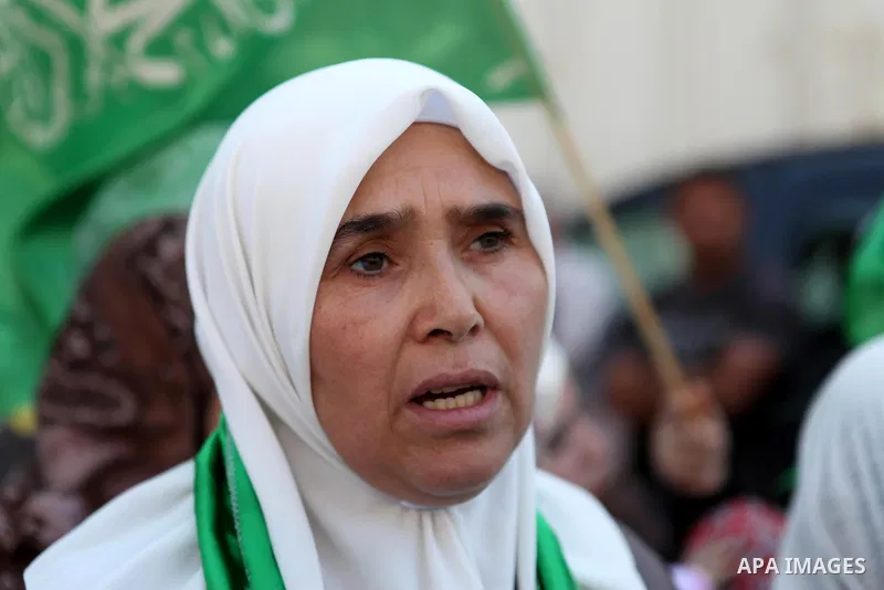 Palestinian women take part in the funeral of Marwan Kawasme and Amar Abu Aysha, Palestinians shot dead by Israeli troops, in the West Bank city of Hebron September 23, 2014. Israeli troops shot dead two Palestinians, in...