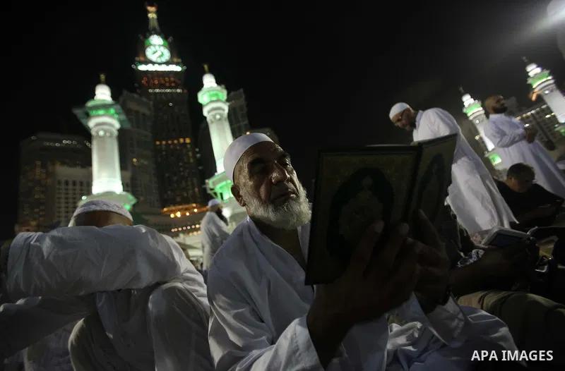 Muslim pilgrims walk outside the Grand Mosque during the annual Hajj in Mecca, Saudi Arabia, Sept. 23, 2014. About 160 countries converge annually on the Islamic cities of Mecca and Medina in western Saudi Arabia for the...