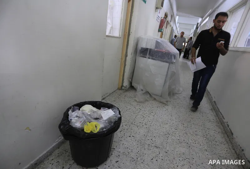 Palestinians wait at al-shifa hospital to receive treatment as clean workers protest to demand for pay their salaries, in Gaza City September 24, 2014. Photo by Mohammed Asad