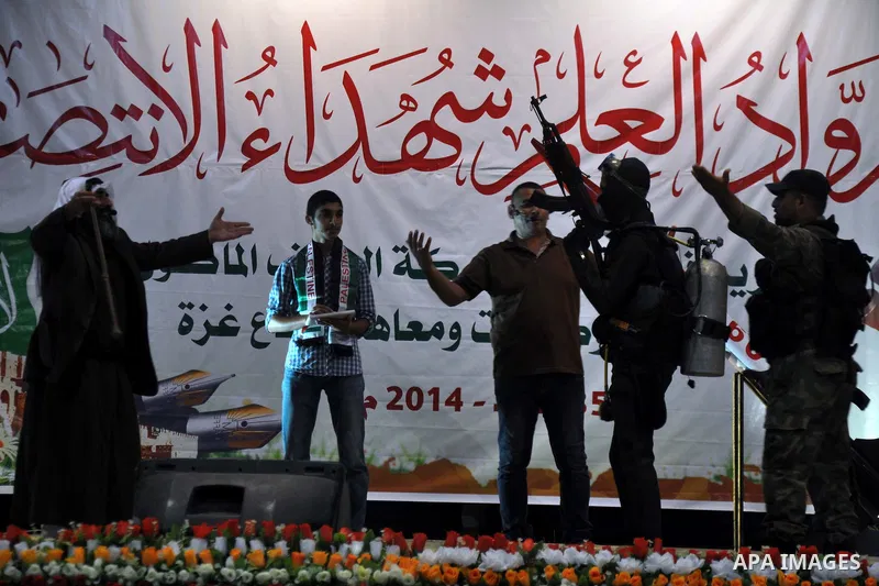 Palestinians attend a ceremony to honor the relatives of the students who were killed in the Israeli offensive on Sep. 25, 2014. An open-ended ceasefire between Israel and Hamas-led Gaza militants, mediated by Egypt, too...