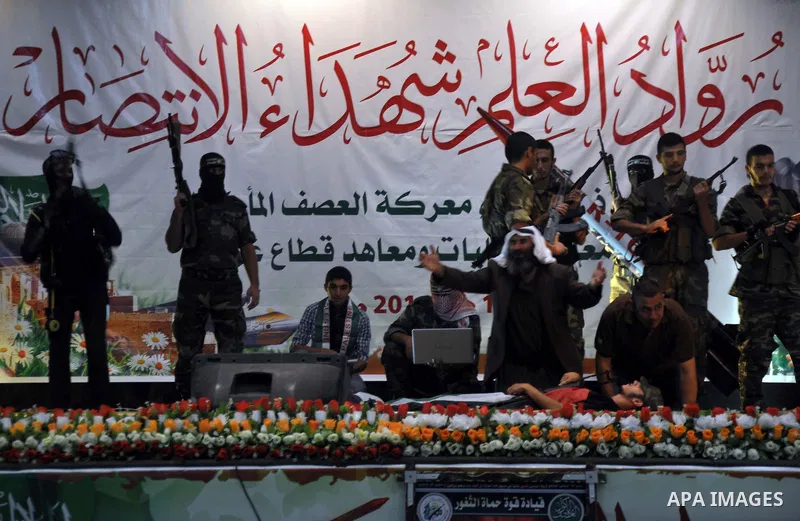 Palestinians attend a ceremony to honor the relatives of the students who were killed in the Israeli offensive on Sep. 25, 2014. An open-ended ceasefire between Israel and Hamas-led Gaza militants, mediated by Egypt, too...