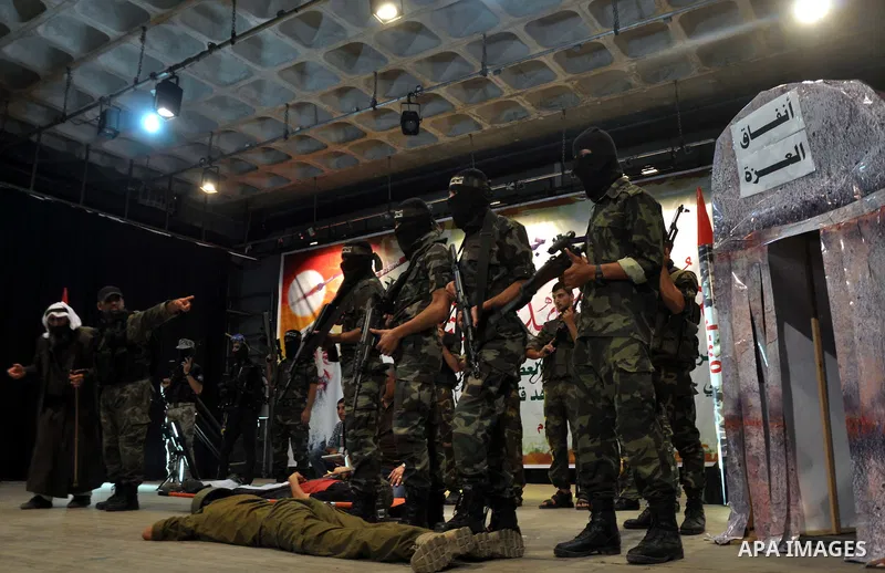 Palestinians attend a ceremony to honor the relatives of the students who were killed in the Israeli offensive on Sep. 25, 2014. An open-ended ceasefire between Israel and Hamas-led Gaza militants, mediated by Egypt, too...