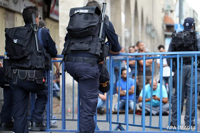 Palestinian Muslims pray outside of the Old City of Jerusalem as Israeli police block them from praying in the city's Al-Aqsa mosque, in the Ras Al-Amud neighborhood of East Jerusalem on Spe. 26, 2014. Israeli police ste...