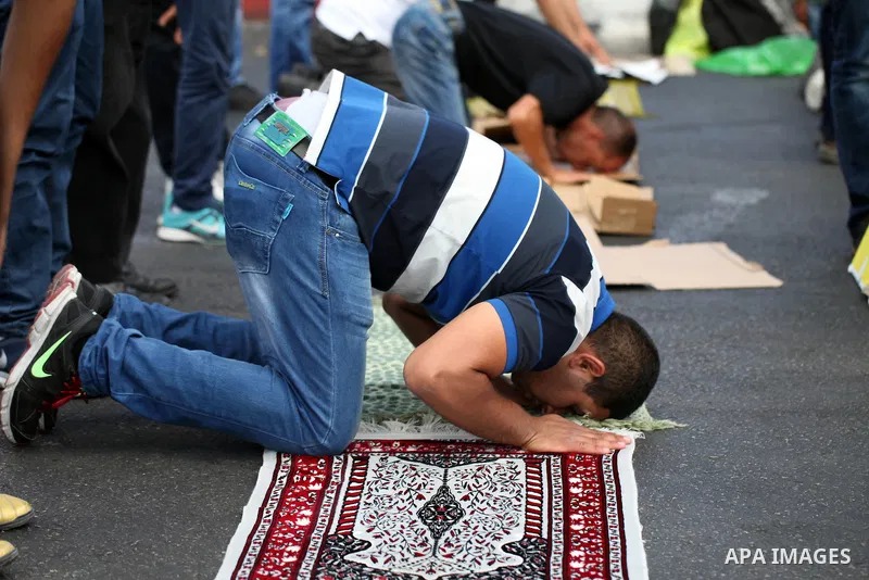 Palestinian Muslims pray outside of the Old City of Jerusalem as Israeli police block them from praying in the city's Al-Aqsa mosque, in the Ras Al-Amud neighborhood of East Jerusalem on Spe. 26, 2014. Israeli police ste...
