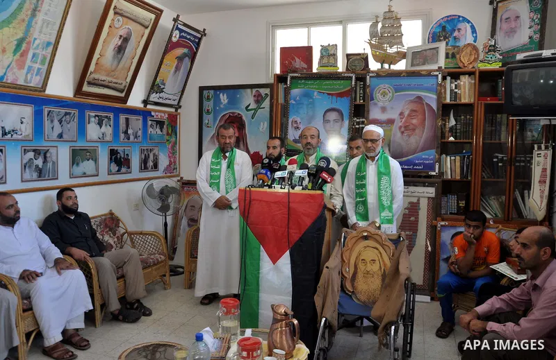 Palestinian Hamas leaders attend a press conference to announce a new public campaign to visit the destroyed houses and the families of Palestinians who were killed by Israel during the summer's fierce offensive, in Gaza...