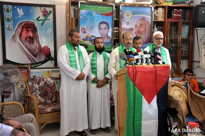 Palestinian Hamas leaders attend a press conference to announce a new public campaign to visit the destroyed houses and the families of Palestinians who were killed by Israel during the summer's fierce offensive, in Gaza...