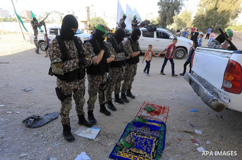 Members of Ezzedin al-Qassam brigades take part in a ceremony to honor Palestinians who were killed by Israel during the summer's fierce offensive, in Gaza city on Sep. 26, 2014. Palestinian leader Mahmoud Abbas returned...