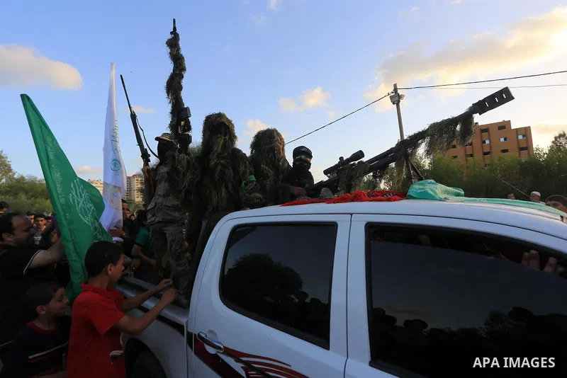 Members of Ezzedin al-Qassam brigades take part in a ceremony to honor Palestinians who were killed by Israel during the summer's fierce offensive, in Gaza city on Sep. 26, 2014. Palestinian leader Mahmoud Abbas returned...