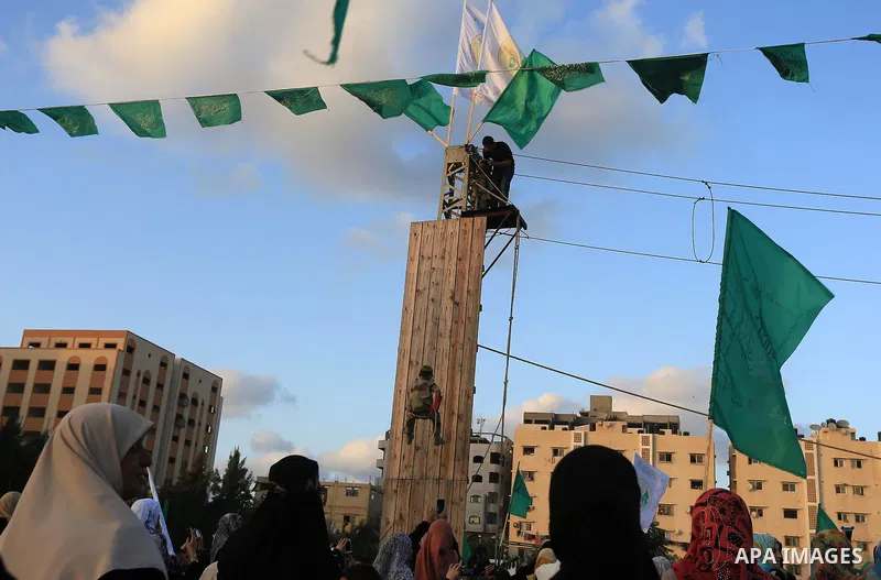 Members of Ezzedin al-Qassam brigades take part in a ceremony to honor Palestinians who were killed by Israel during the summer's fierce offensive, in Gaza city on Sep. 26, 2014. Palestinian leader Mahmoud Abbas returned...