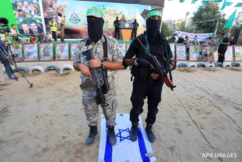 Members of Ezzedin al-Qassam brigades take part in a ceremony to honor Palestinians who were killed by Israel during the summer's fierce offensive, in Gaza city on Sep. 26, 2014. Palestinian leader Mahmoud Abbas returned...