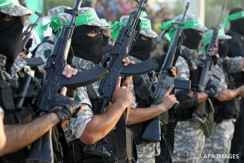 Members of Ezzedin al-Qassam brigades take part in a ceremony to honor Palestinians who were killed by Israel during the summer's fierce offensive, in Gaza city on Sep. 26, 2014. Palestinian leader Mahmoud Abbas returned...