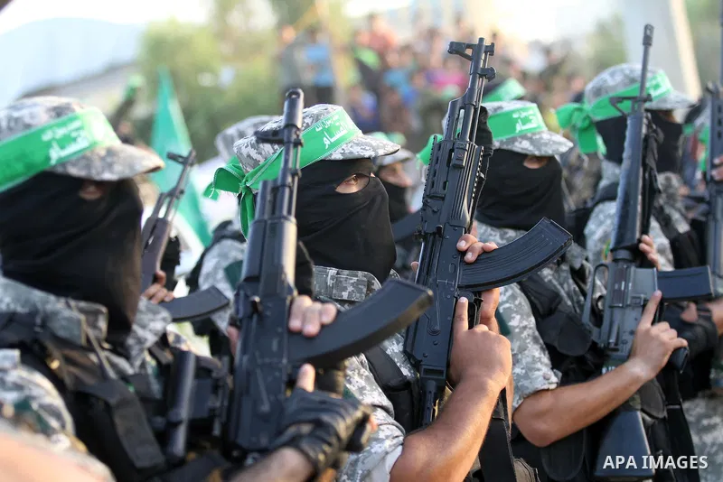 Members of Ezzedin al-Qassam brigades take part in a ceremony to honor Palestinians who were killed by Israel during the summer's fierce offensive, in Gaza city on Sep. 26, 2014. Palestinian leader Mahmoud Abbas returned...