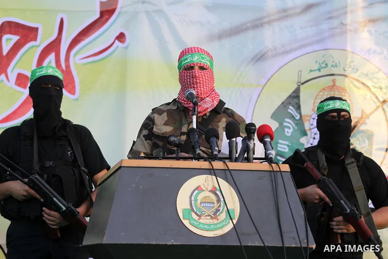 Members of Ezzedin al-Qassam brigades take part in a ceremony to honor Palestinians who were killed by Israel during the summer's fierce offensive, in Gaza city on Sep. 26, 2014. Palestinian leader Mahmoud Abbas returned...