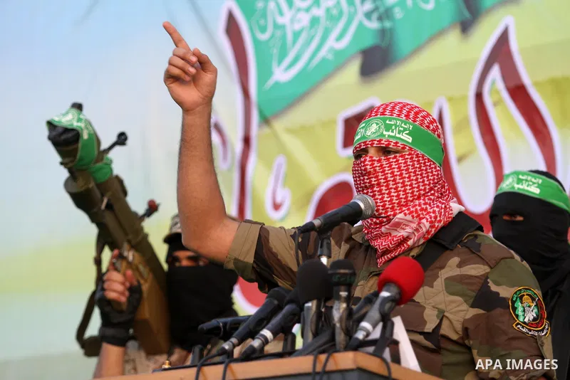 Members of Ezzedin al-Qassam brigades take part in a ceremony to honor Palestinians who were killed by Israel during the summer's fierce offensive, in Gaza city on Sep. 26, 2014. Palestinian leader Mahmoud Abbas returned...
