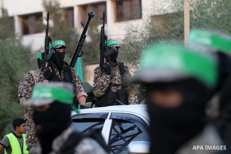 Members of Ezzedin al-Qassam brigades take part in a ceremony to honor Palestinians who were killed by Israel during the summer's fierce offensive, in Gaza city on Sep. 26, 2014. Palestinian leader Mahmoud Abbas returned...
