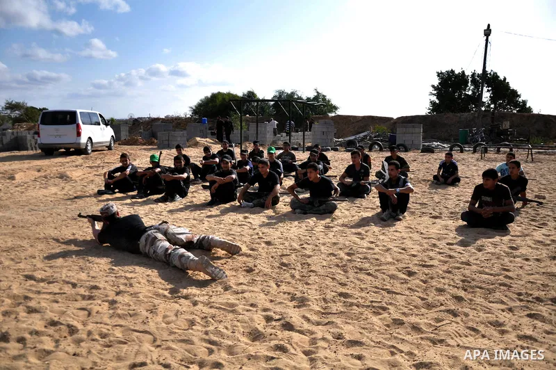 Young Palestinians take part in a military-style exercise at a training course organized by Hamas movement in Gaza City Spe. 28, 2014. Reports said that Hamas planning to establish a 'popular army' in Gaza to help in nex...