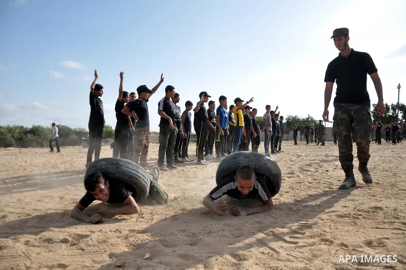 Young Palestinians take part in a military-style exercise at a training course organized by Hamas movement in Gaza City Spe. 28, 2014. Reports said that Hamas planning to establish a 'popular army' in Gaza to help in nex...