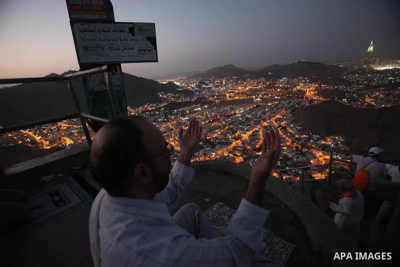 A Muslim pilgrim prays at Mount Al-Noor during the annual haj pilgrimage in Mecca, on September 29, 2014, Mount Al-Noor houses Ghar-E-Hira or Hira cave, where Prophet Mohammad is said to have spent a great deal of time i...