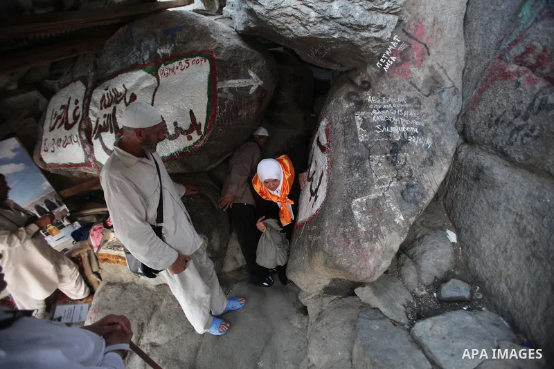 Muslim pilgrims pray at the entrance of Hera cave on Mount Al-Noor during the annual haj pilgrimage in Mecca, on September 29, 2014, Mount Al-Noor houses Ghar-E-Hira or Hira cave, where Prophet Mohammad is said to have s...