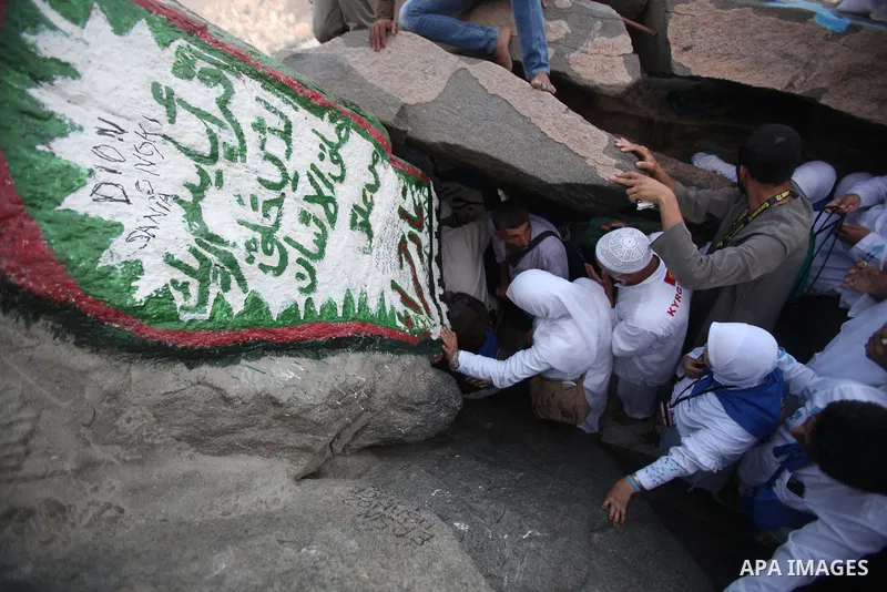 Muslim pilgrims pray at the entrance of Hera cave on Mount Al-Noor during the annual haj pilgrimage in Mecca, on September 29, 2014, Mount Al-Noor houses Ghar-E-Hira or Hira cave, where Prophet Mohammad is said to have s...