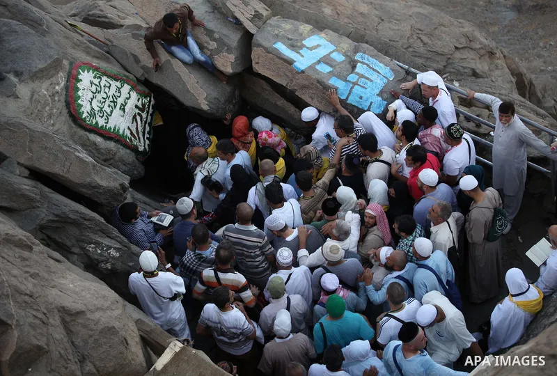 Muslim pilgrims pray at Mount Al-Noor during the annual haj pilgrimage in Mecca, on September 28, 2014, Mount Al-Noor houses Ghar-E-Hira or Hira cave, where Prophet Mohammad is said to have spent a great deal of time in...