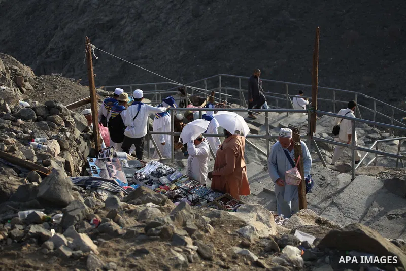 Muslim pilgrims pray at Mount Al-Noor during the annual haj pilgrimage in Mecca, on September 28, 2014, Mount Al-Noor houses Ghar-E-Hira or Hira cave, where Prophet Mohammad is said to have spent a great deal of time in...