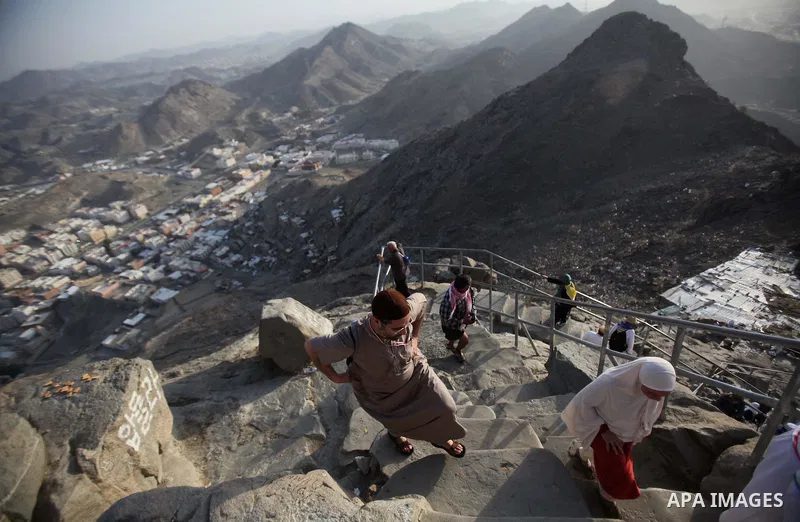 Muslim pilgrims pray at Mount Al-Noor during the annual haj pilgrimage in Mecca, on September 28, 2014, Mount Al-Noor houses Ghar-E-Hira or Hira cave, where Prophet Mohammad is said to have spent a great deal of time in...