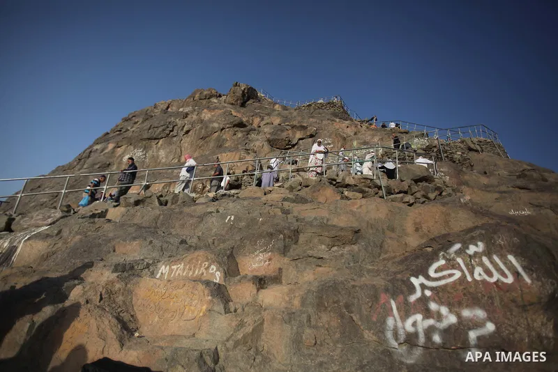 Muslim pilgrims pray at Mount Al-Noor during the annual haj pilgrimage in Mecca, on September 28, 2014, Mount Al-Noor houses Ghar-E-Hira or Hira cave, where Prophet Mohammad is said to have spent a great deal of time in...