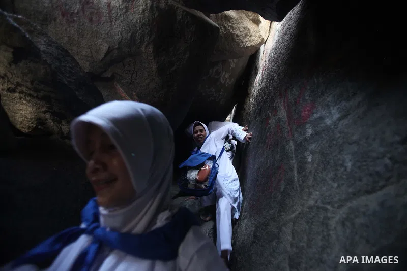 A Muslim pilgrim prays at the Hera cave on Mount Al-Noor during the annual haj pilgrimage in Mecca, on September 29, 2014, Mount Al-Noor houses Ghar-E-Hira or Hira cave, where Prophet Mohammad is said to have spent a gre...