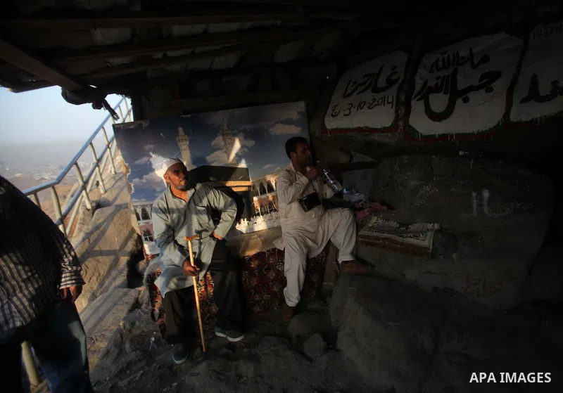 Muslim pilgrims pray at Mount Al-Noor during the annual haj pilgrimage in Mecca, on September 28, 2014, Mount Al-Noor houses Ghar-E-Hira or Hira cave, where Prophet Mohammad is said to have spent a great deal of time in...