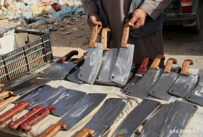 A Palestinian man displays grinded knives during the preparation for the Eid al-Adha festival in the West Bank city of Nablus, Sept. 29, 2014. Muslims worldwide are celebrating Eid al-Adha, or Feast of the Sacrifice, com...