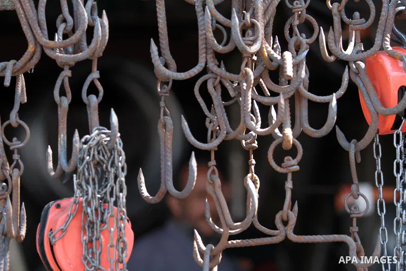 A Palestinian man sells butcher equipments at his shop during the preparation for the Eid al-Adha festival in Gaza, Sept. 29, 2014. Muslims worldwide are celebrating Eid al-Adha, or Feast of the Sacrifice, commemorating...
