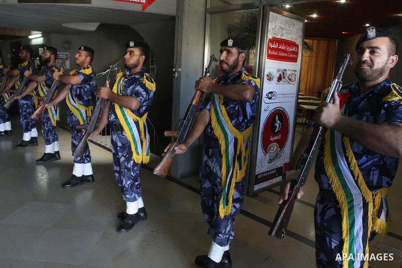 Palestinian policemen attend a ceremony to honor their relatives who were killed by Israel during the summer's fierce offensive, in Gaza city on Sep. 30, 2014. An open-ended ceasefire between Israel and Hamas-led Gaza mi...
