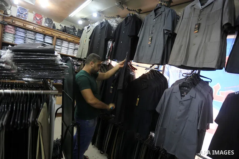 Palestinians shop at market during the preparation for the Eid al-Adha festival in Gaza, Sept. 30, 2014. Muslims worldwide are celebrating Eid al-Adha, or Feast of the Sacrifice, commemorating God's provision of a ram to...