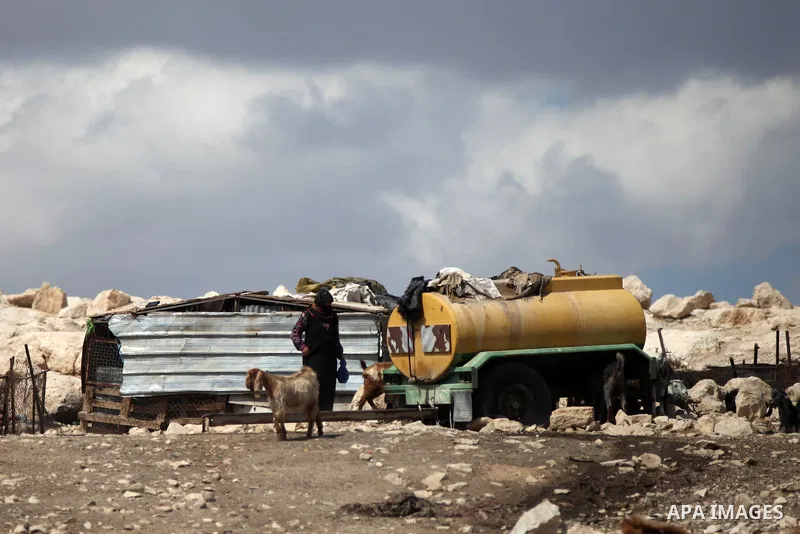 A Palestinian Bedouin woman stands outside her dwelling, in the West Bank village of Al-Eizariya, near east of Jerusalem, on Septemper 30, 2014. Israel's Civil Administration in the West Bank is advancing a plan to expel...