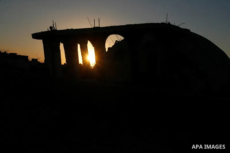 The rubbles of a destroyed house is seen during the sunset in the east of Khan Younis in the southern Gaza Strip October 1, 2014. An open-ended ceasefire between Israel and Hamas-led Gaza militants, mediated by Egypt, to...