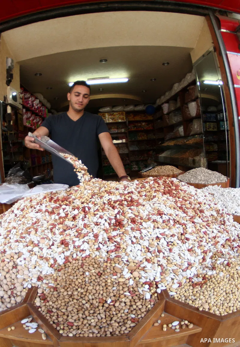 A Palestinian man sales nuts during the preparation for the Eid al-Adha festival in the West Bank city of Nablus, Oct. 02, 2014. Muslims worldwide are celebrating Eid al-Adha, or Feast of the Sacrifice, commemorating God...