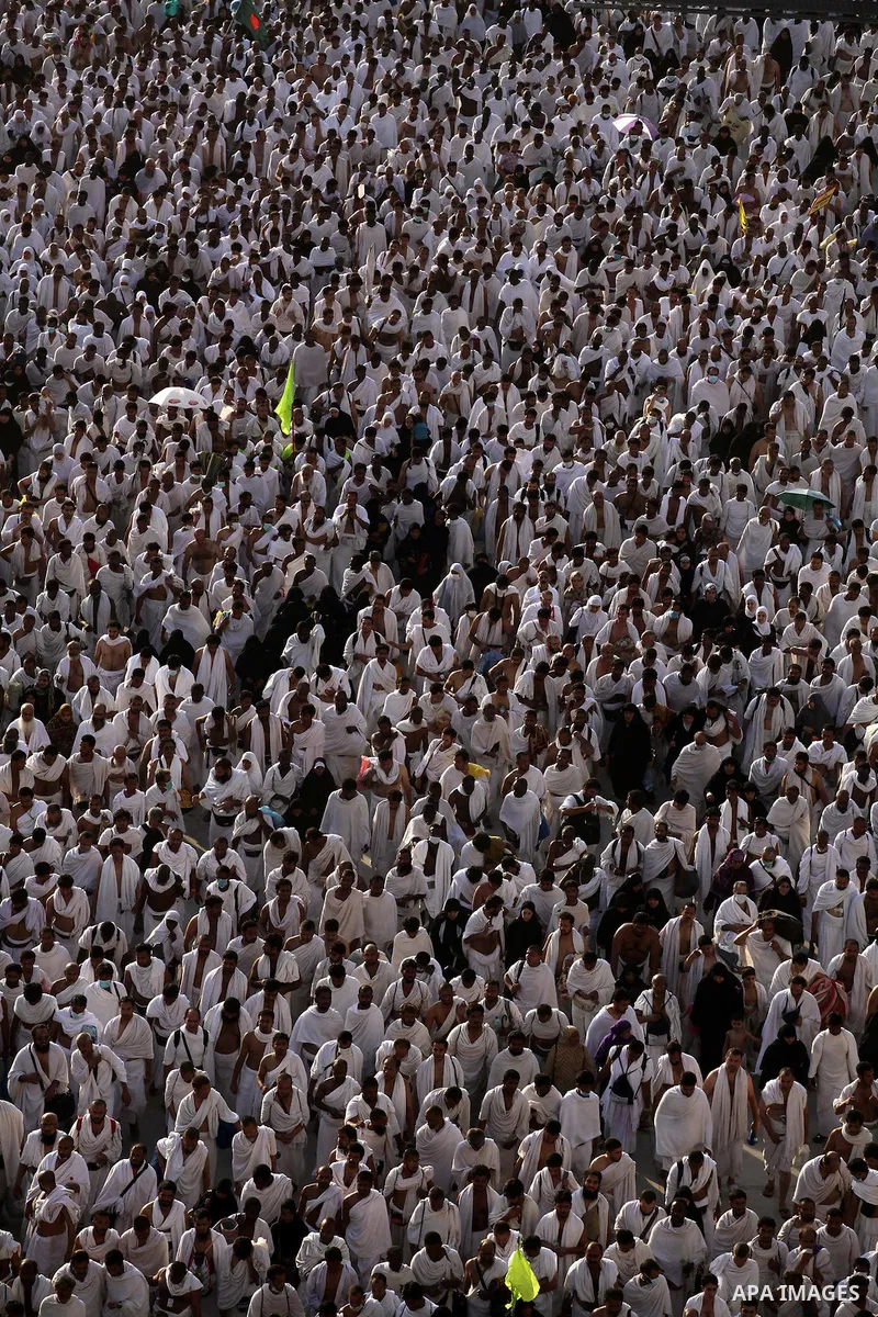 Muslim pilgrims walk to cast stones at a pillar, symbolizing the stoning of Satan, in a ritual called "Jamarat," a rite of the annual hajj, in Mina near the holy city of Mecca on October 04, 2014. The pilgrims perform a...