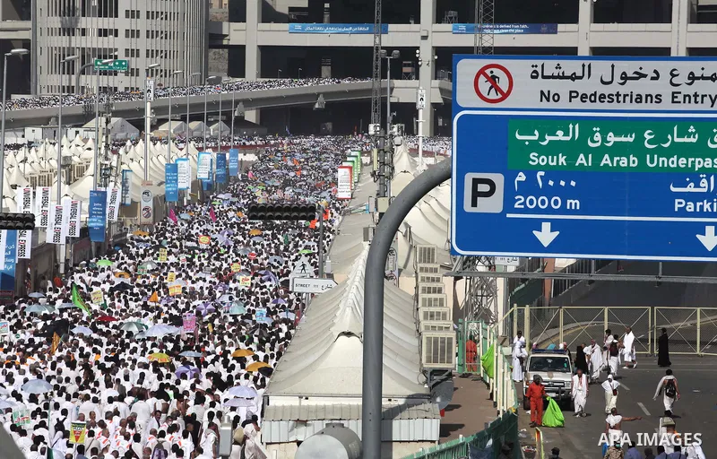 Muslim pilgrims walk to cast stones at a pillar, symbolizing the stoning of Satan, in a ritual called "Jamarat," a rite of the annual hajj, in Mina near the holy city of Mecca on October 04, 2014. The pilgrims perform a...