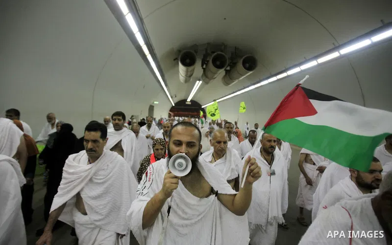 Palestinian Muslim pilgrims arrive to cast stones at a pillar, symbolizing the stoning of Satan, in a ritual called "Jamarat," a rite of the annual hajj, in Mina near the holy city of Mecca on October 04, 2014. The pilgr...