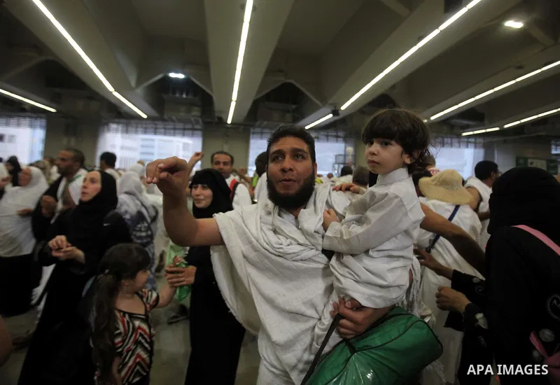 Muslim pilgrims cast stones at a pillar, symbolizing the stoning of Satan, in a ritual called "Jamarat," a rite of the annual hajj, in Mina near the holy city of Mecca on October 04, 2014. The pilgrims perform a series o...