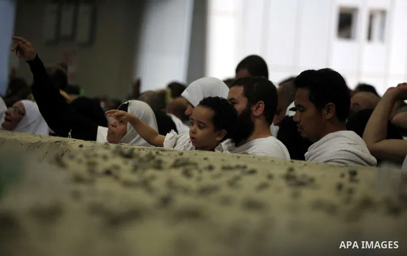 Muslim pilgrims cast stones at a pillar, symbolizing the stoning of Satan, in a ritual called "Jamarat," a rite of the annual hajj, in Mina near the holy city of Mecca on October 04, 2014. The pilgrims perform a series o...