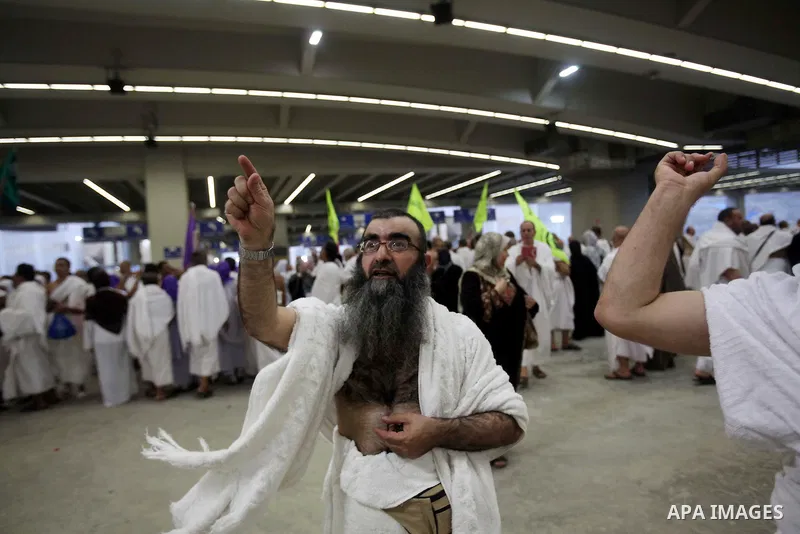 Muslim pilgrims cast stones at a pillar, symbolizing the stoning of Satan, in a ritual called "Jamarat," a rite of the annual hajj, in Mina near the holy city of Mecca on October 04, 2014. The pilgrims perform a series o...