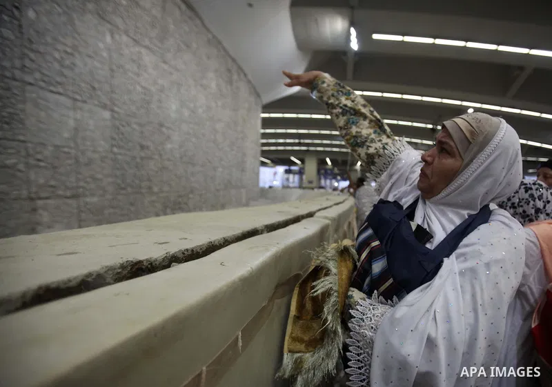 Muslim pilgrims cast stones at a pillar, symbolizing the stoning of Satan, in a ritual called "Jamarat," a rite of the annual hajj, in Mina near the holy city of Mecca on October 04, 2014. The pilgrims perform a series o...
