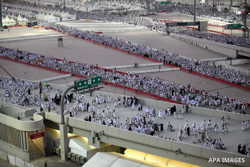 Muslim pilgrims walk to cast stones at a pillar, symbolizing the stoning of Satan, in a ritual called "Jamarat," a rite of the annual hajj, in Mina near the holy city of Mecca on October 04, 2014. The pilgrims perform a...