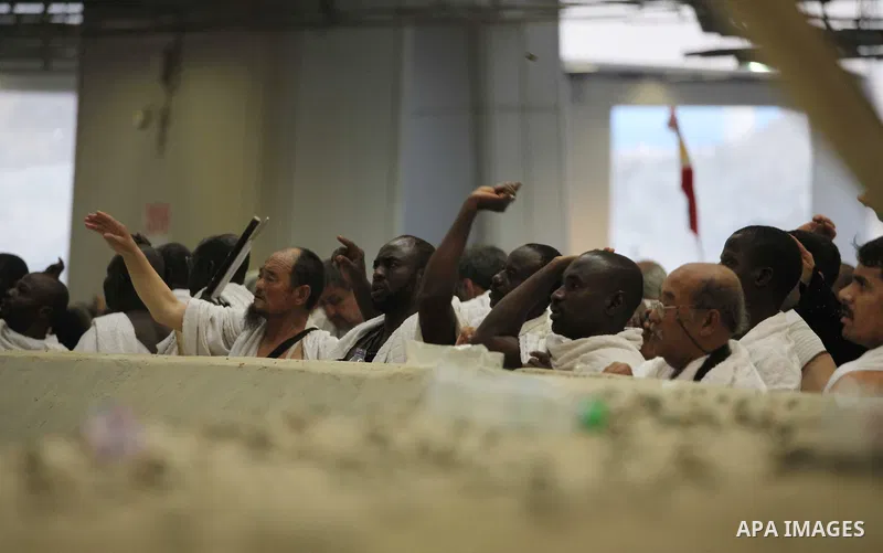 Muslim pilgrims cast stones at a pillar, symbolizing the stoning of Satan, in a ritual called "Jamarat," a rite of the annual hajj, in Mina near the holy city of Mecca on October 04, 2014. The pilgrims perform a series o...