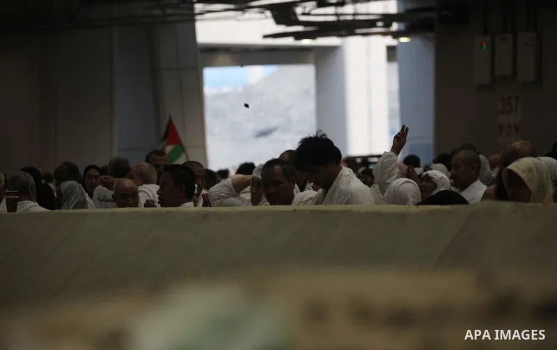 Muslim pilgrims cast stones at a pillar, symbolizing the stoning of Satan, in a ritual called "Jamarat," a rite of the annual hajj, in Mina near the holy city of Mecca on October 04, 2014. The pilgrims perform a series o...