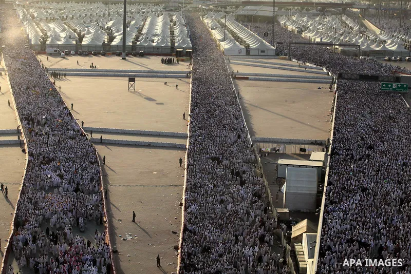 Muslim pilgrims walk to cast stones at a pillar, symbolizing the stoning of Satan, in a ritual called "Jamarat," a rite of the annual hajj, in Mina near the holy city of Mecca on October 04, 2014. The pilgrims perform a...