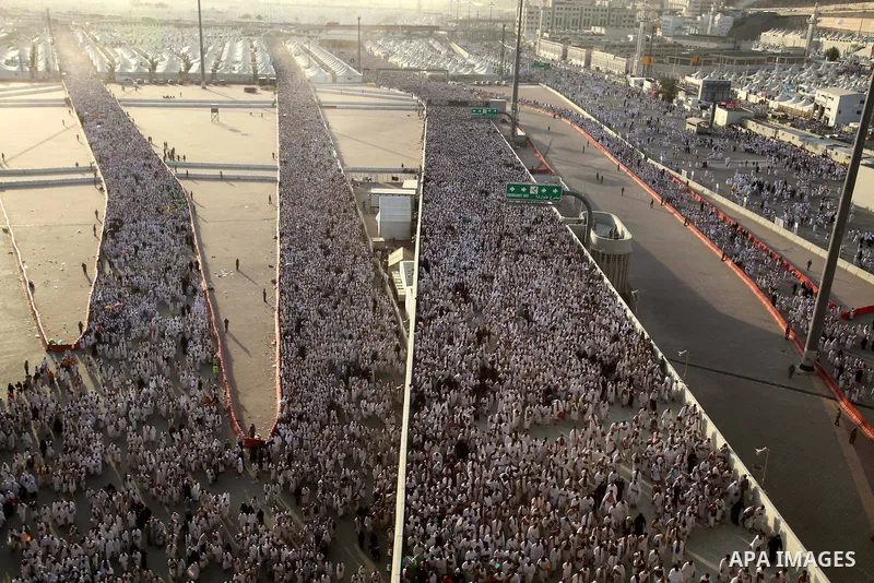 Muslim pilgrims walk to cast stones at a pillar, symbolizing the stoning of Satan, in a ritual called "Jamarat," a rite of the annual hajj, in Mina near the holy city of Mecca on October 04, 2014. The pilgrims perform a...